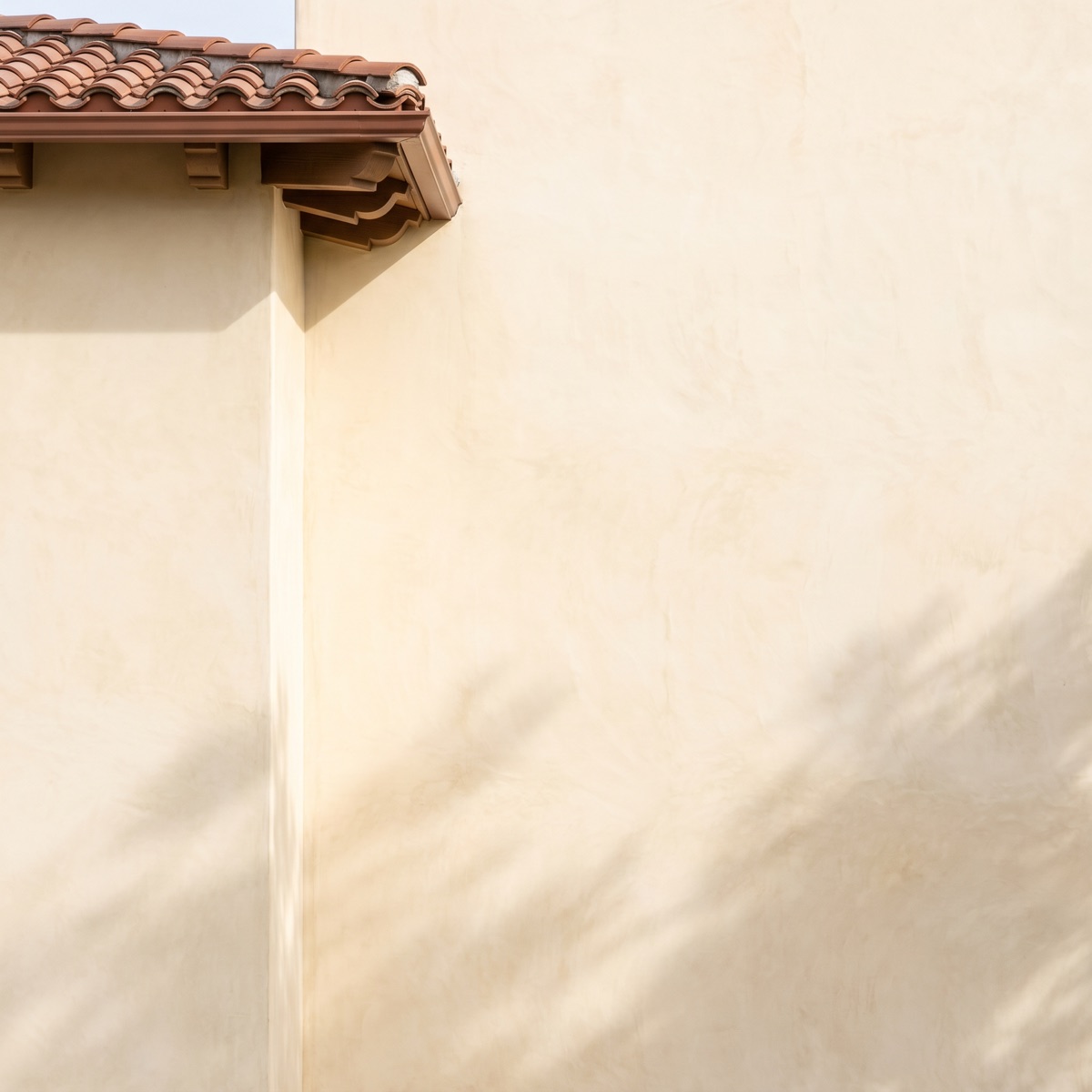 Warm Mediterranean stucco wall, freshly soft washed and bright